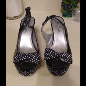 Miss Bisou sling back peep-toe platforms.